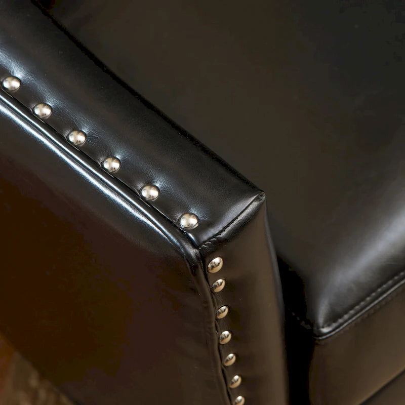 Poltrona Club in similpelle nera con borchie argentate e struttura in legno massello